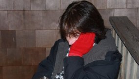 brenda with noogy on stormy ferry dock bench